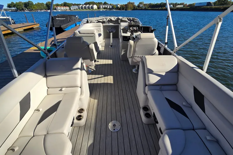 Slide: The Image of 2023 G3 Select 22RC pontoon boat interior with plush seating and lake view. - 13