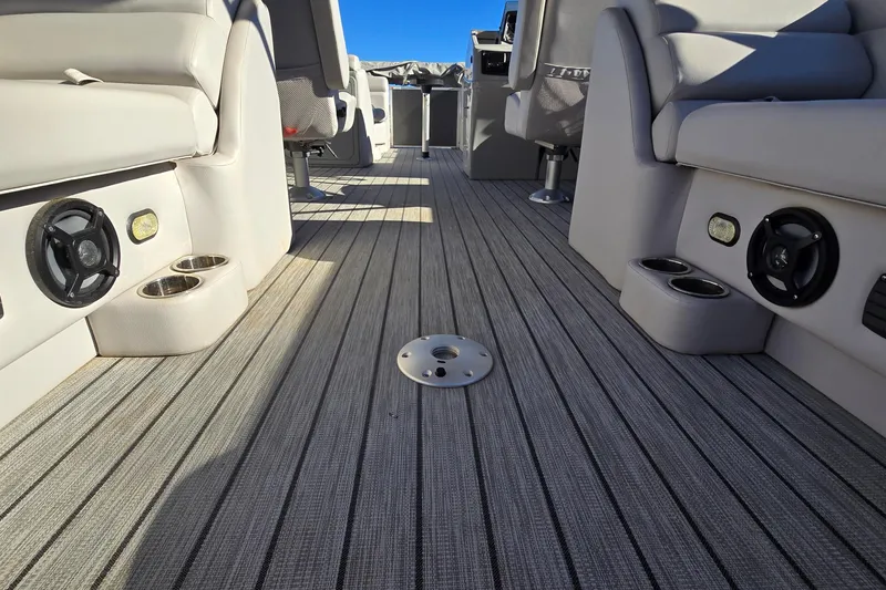 Slide: The Image of 2023 G3 Select 22RC boat interior with gray seating, speakers, and cup holders. - 15