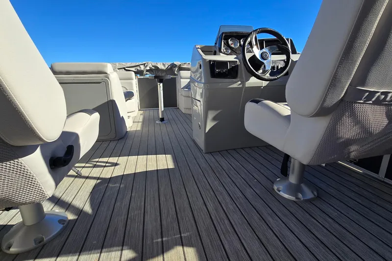 Slide: The Image of 2023 G3 Select 22RC boat interior with steering wheel and seating on deck. - 17