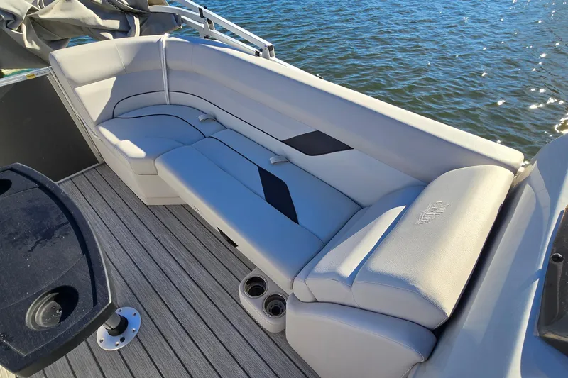 Slide: The Image of 2023 G3 Select 22RC boat with luxurious seating and cup holders on a sunny day. - 19