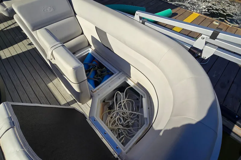 Slide: The Image of 2023 G3 Select 22RC boat with open storage compartment, revealing ropes and equipment. - 24