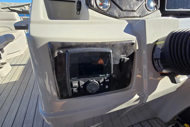 Slide: The Image of 2023 G3 Select 22RC boat dashboard with control panel and Bluetooth audio system. - 29