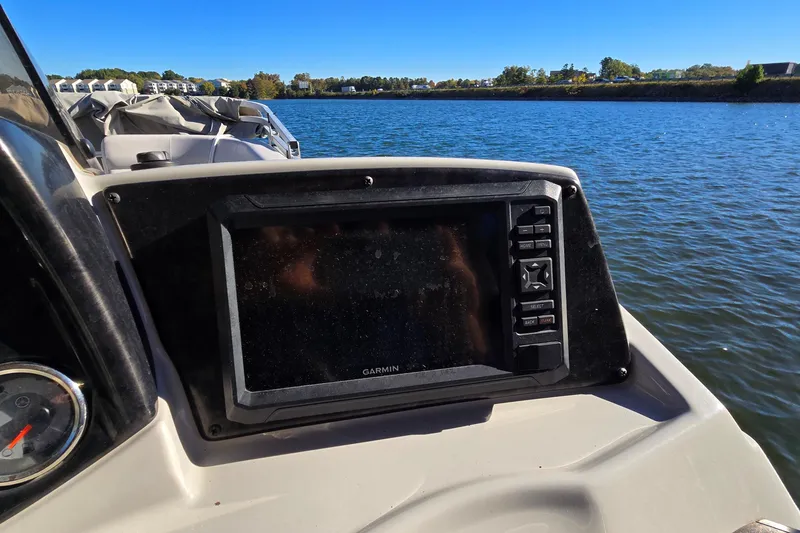 Slide: The Image of 2023 G3 Select 22RC boat dashboard with Garmin display on a sunny day. - 30