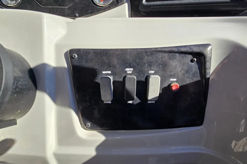 Slide: The Image of Control panel of 2023 G3 Select 22RC boat with switches and horn button. - 31