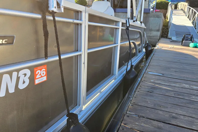 Slide: The Image of 2023 G3 Select 22RC pontoon boat docked beside wooden pier. - 37