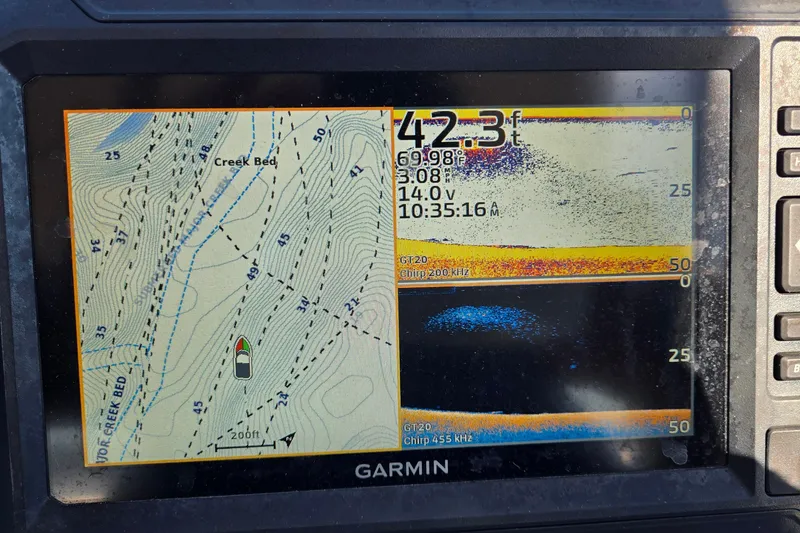 Slide: The Image of Garmin fishfinder display showing depth, temperature, and creek bed map on a G3 Select 22RC. - 43