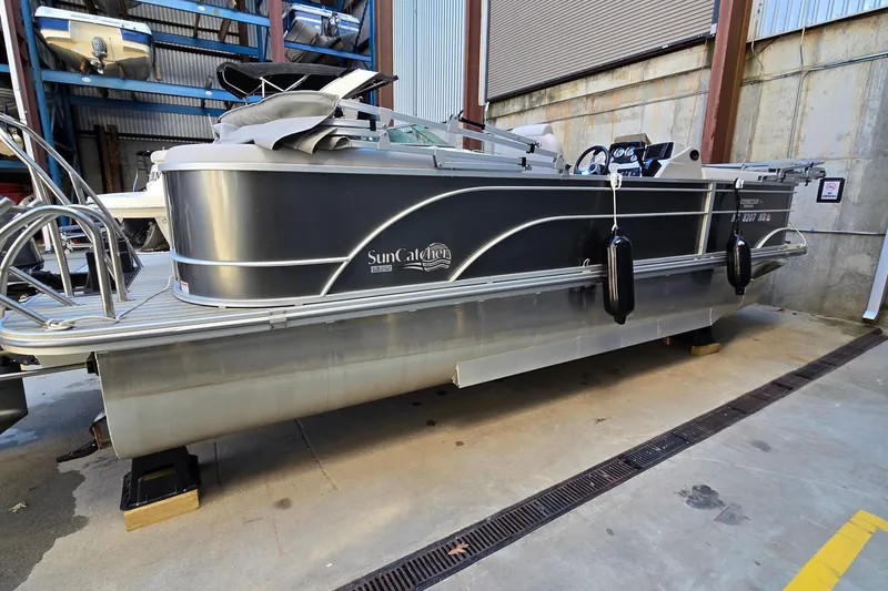 Slide: The Image of 2023 G3 Select 22RC pontoon boat in storage, featuring sleek design and modern amenities. - 46