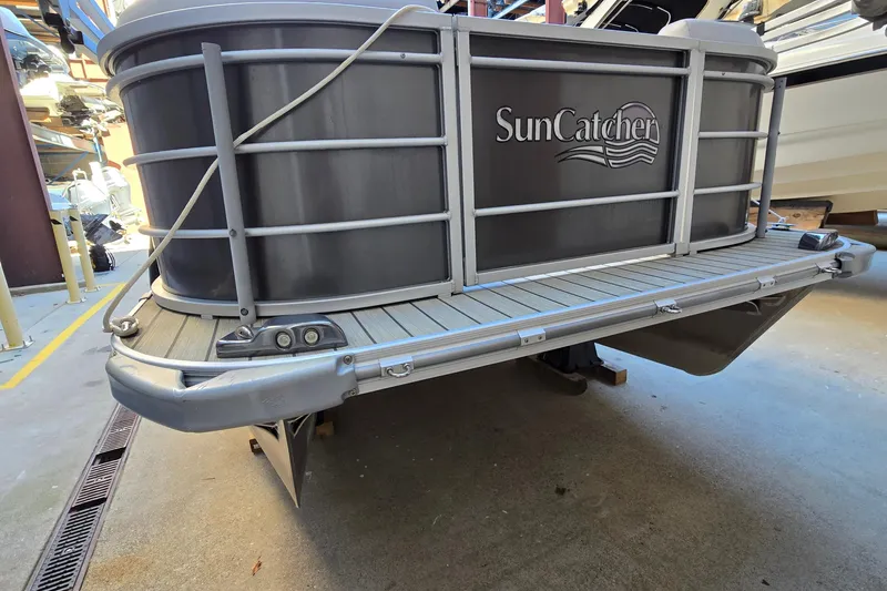 Slide: The Image of 2023 G3 Select 22RC SunCatcher pontoon boat rear view in storage facility. - 47