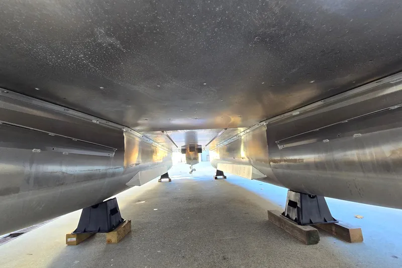 Slide: The Image of Underneath view of 2023 G3 Select 22RC boat hull on supports. - 48