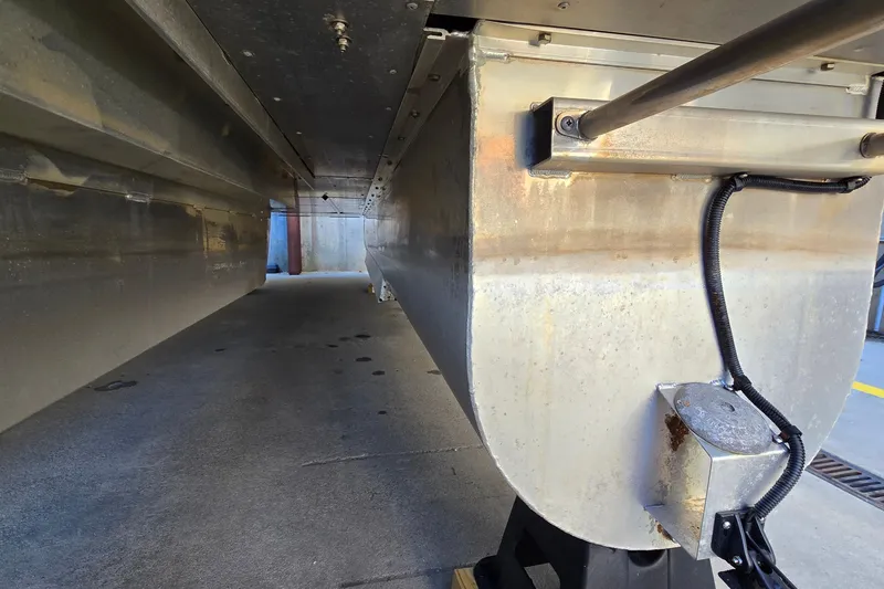 Slide: The Image of 2023 G3 Select 22RC pontoon undercarriage with visible wiring and metal structure. - 55