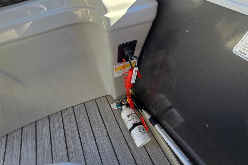 Slide: The Image of 2023 G3 Select 22RC boat interior with safety equipment and fire extinguisher. - 62