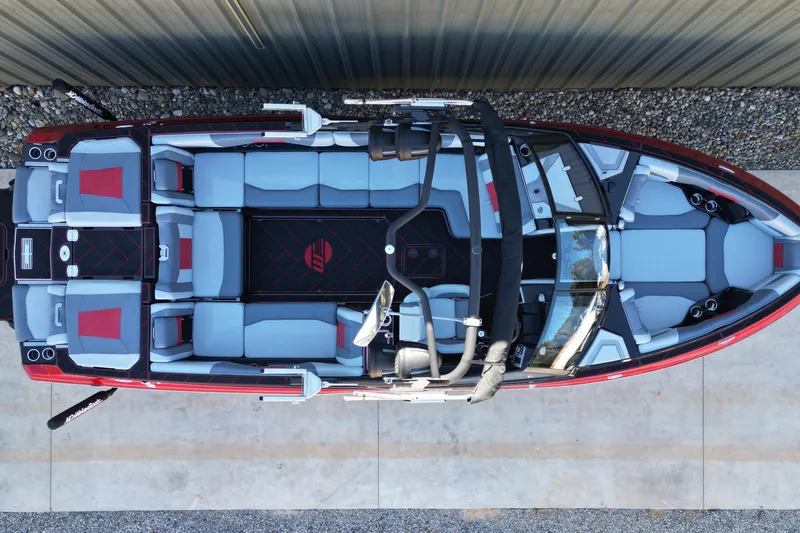 Slide: The Image of 2023 Malibu Wakesetter 25 LSV boat, top view, showcasing spacious seating and sleek design. - 14