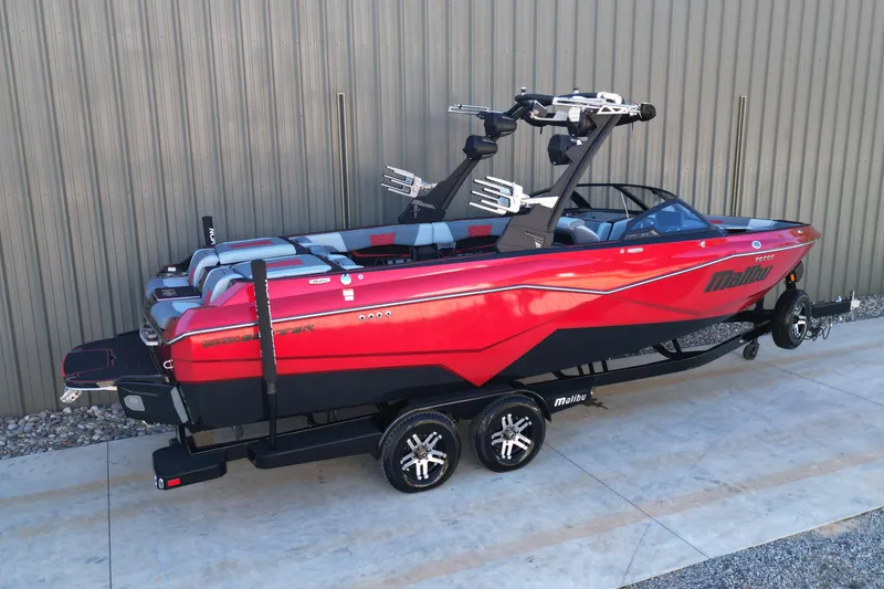 Slide: The Image of 2023 Malibu Wakesetter 25 LSV boat in vibrant red on a trailer. - 3