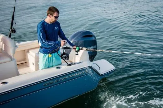 Slide: The Image of Manufacturer Provided Image: Man fishing on a 2018 Grady-White Fisherman 216 boat in open water. - 11