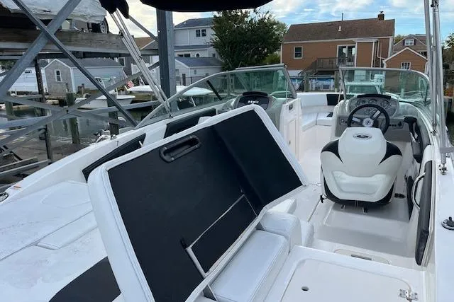 Slide: The Image of 2016 Chaparral 21 H2O Sport boat interior with seating and steering wheel. - 5