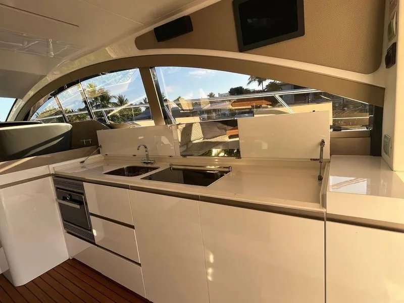 Slide: The Image of Luxurious kitchen area on a 2019 Schaefer 510 yacht with modern appliances and sleek design. - 19