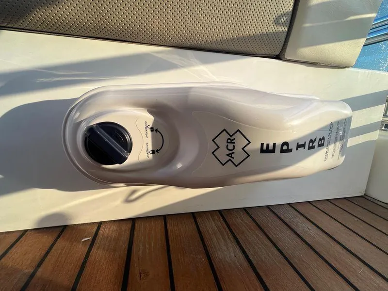 Slide: The Image of EPIRB device on Schaefer 510 yacht, 2019 model, mounted on wooden deck. - 24