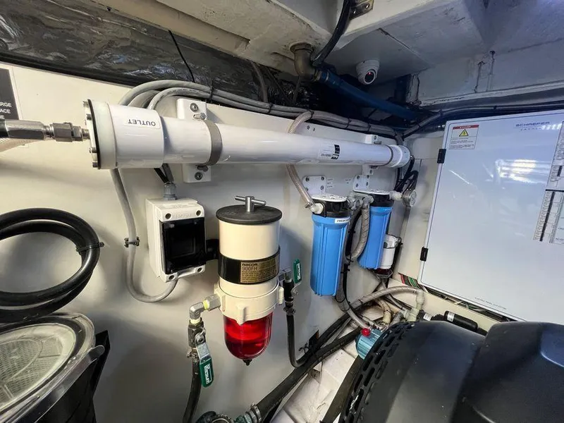 Slide: The Image of Engine room of a 2019 Schaefer 510 yacht with filtration system and control panel. - 33