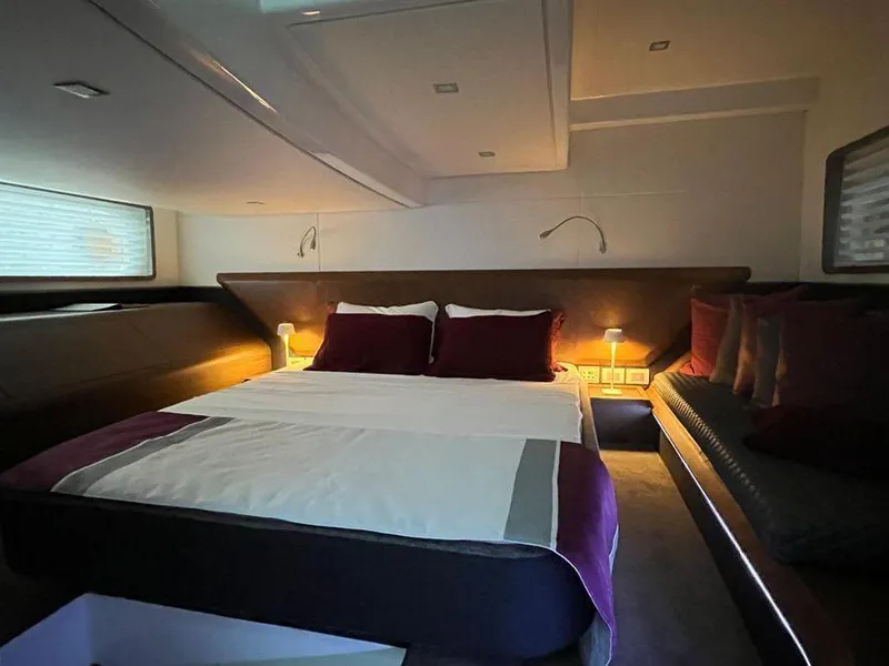 Slide: The Image of Luxurious cabin interior of 2019 Schaefer 510 yacht with cozy bed and ambient lighting. - 38