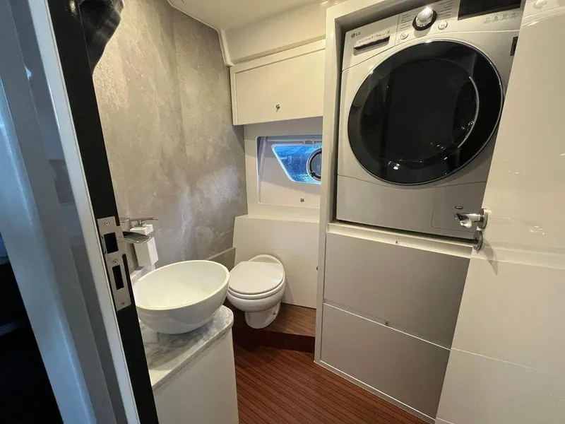 Slide: The Image of Compact bathroom in 2019 Schaefer 510 yacht with washer-dryer, sink, and toilet. - 42