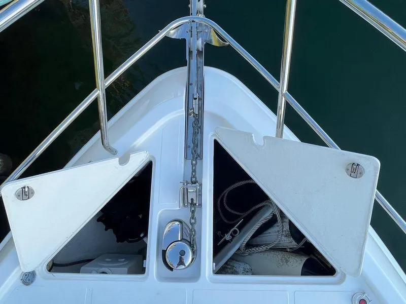 Slide: The Image of Bow of 2019 Schaefer 510 yacht with open anchor compartments and chain. - 43