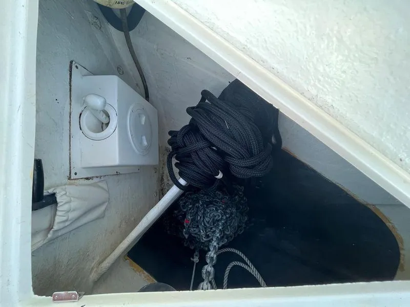 Slide: The Image of Storage compartment in a 2019 Schaefer 510 boat with ropes and equipment. - 45