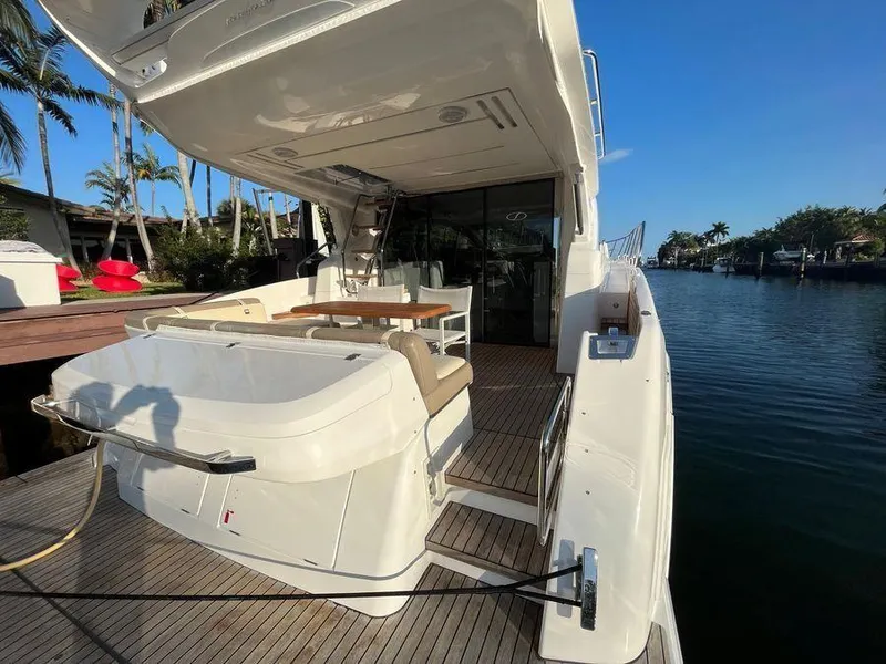 Slide: The Image of Luxury Schaefer 510 yacht, 2019 model, docked with elegant outdoor seating area. - 49