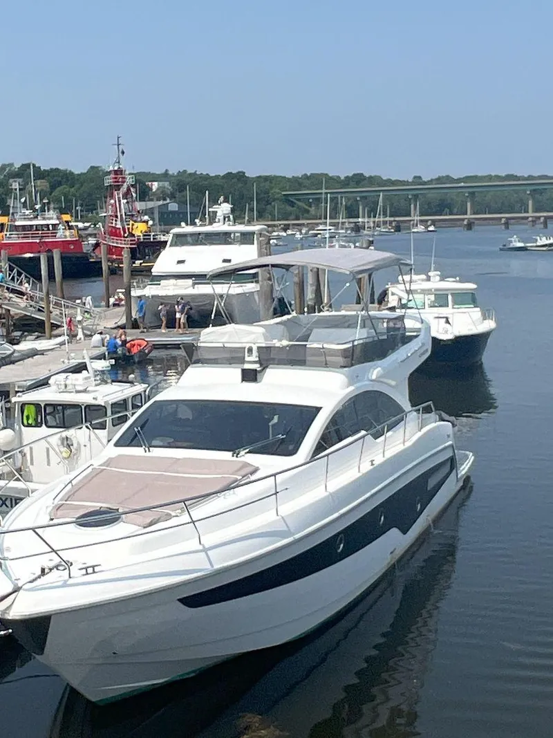 Slide: The Image of Luxury Schaefer 510 yacht docked at marina, 2019 model. - 5