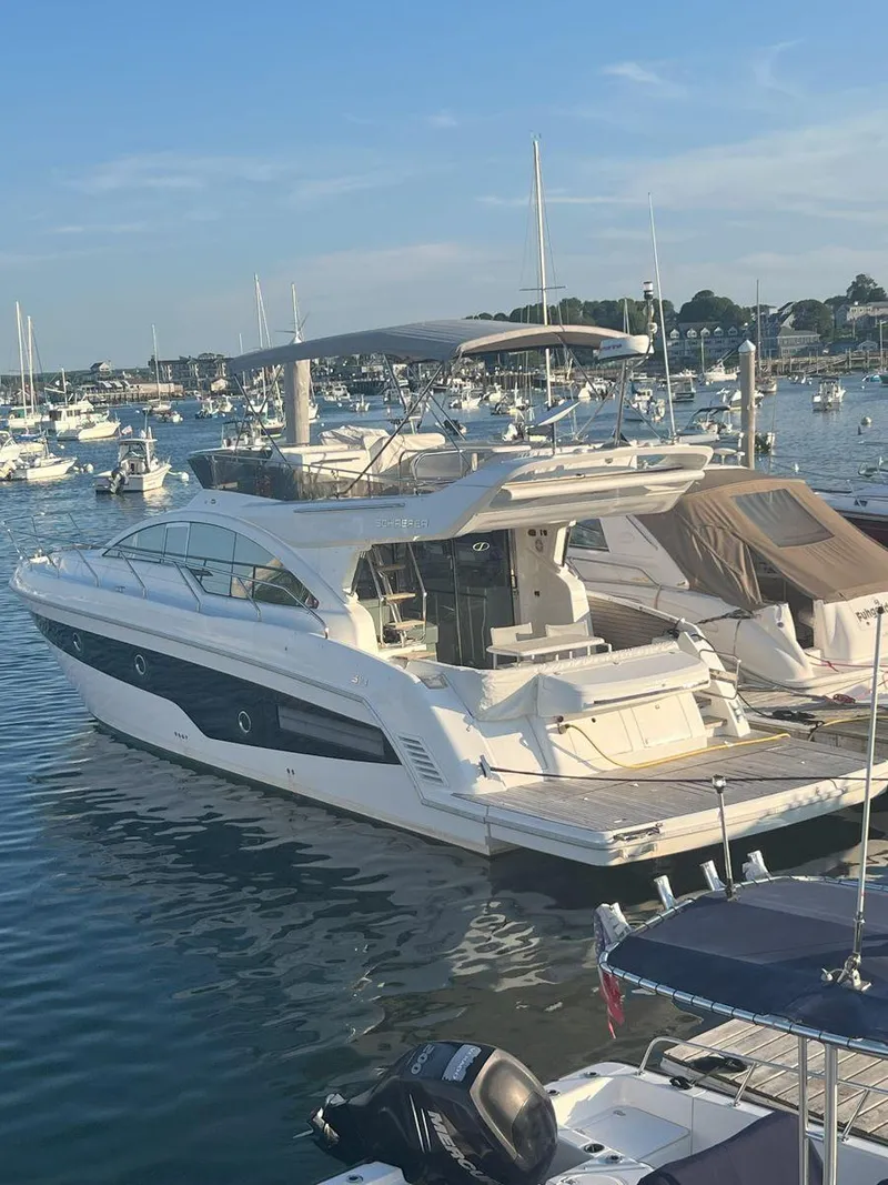 Slide: The Image of Luxury Schaefer 510 yacht docked in a marina, 2019 model. - 6