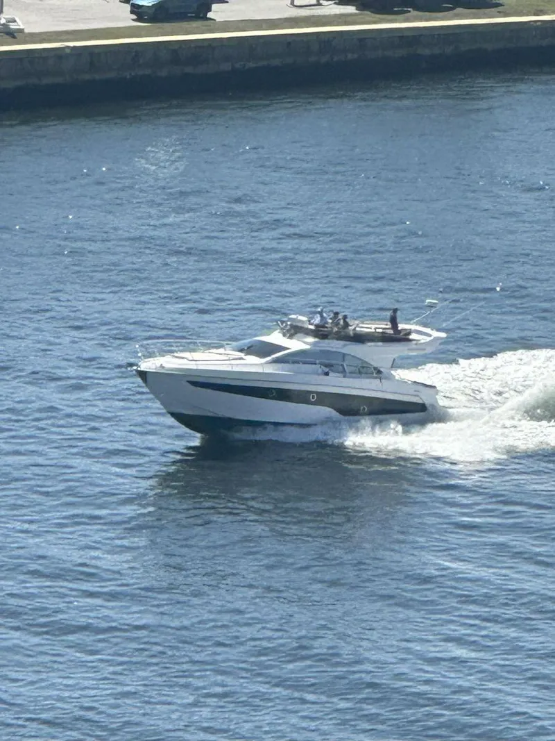 Slide: The Image of 2019 Schaefer 510 yacht cruising on a sunny day in open water. - 7