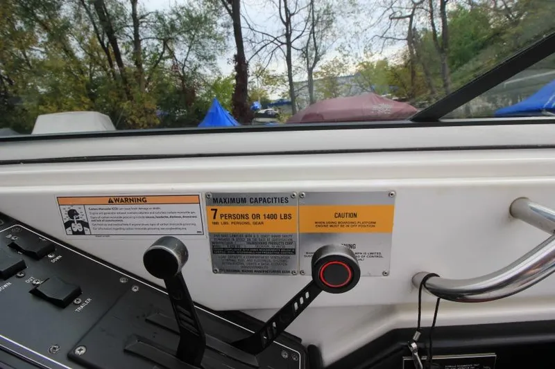 Slide: The Image of Control panel of a 1989 Formula 223 SS boat with capacity warning labels. - 15