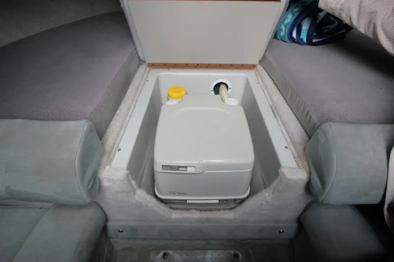 Slide: The Image of 1989 Formula 223 SS boat interior with built-in portable toilet compartment. - 19
