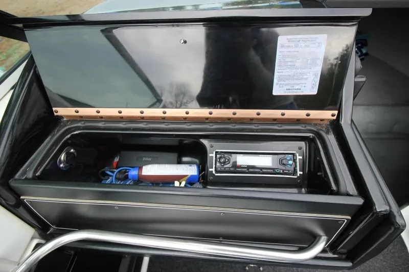Slide: The Image of 1989 Formula 223 SS boat storage compartment with stereo and accessories. - 20