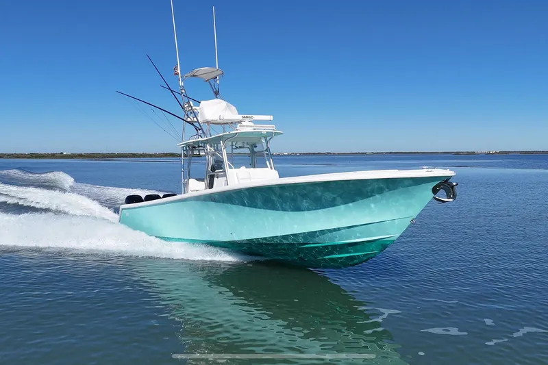 Slide: The Image of 2013 SeaVee 39B Center Console boat cruising on calm waters. - 0