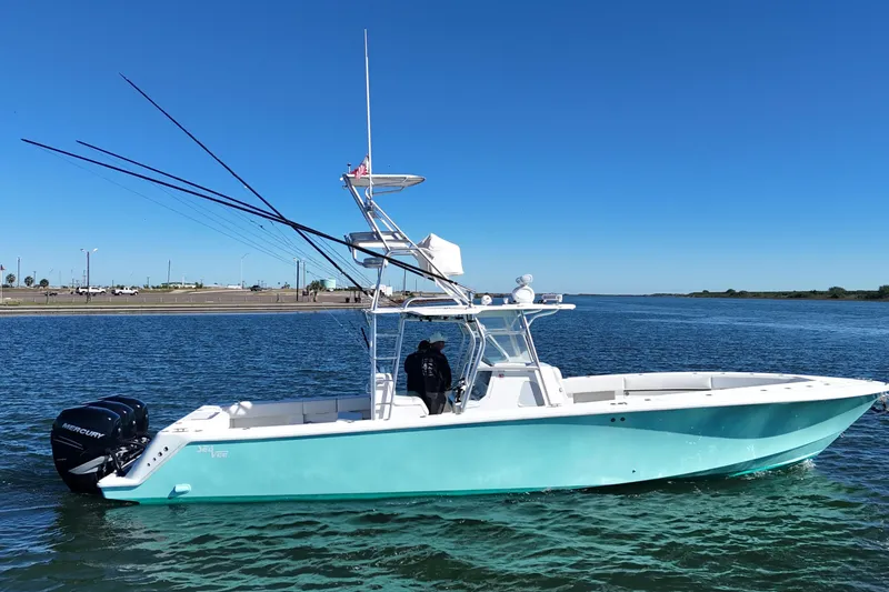 Slide: The Image of 2013 SeaVee 39B Center Console boat on calm water, clear blue sky. - 10