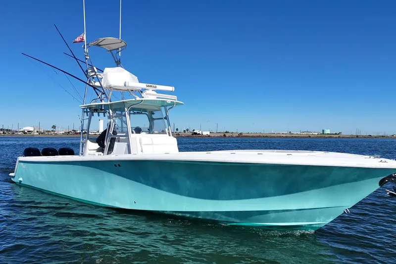Slide: The Image of 2013 SeaVee 39B Center Console boat on calm water, clear blue sky. - 12