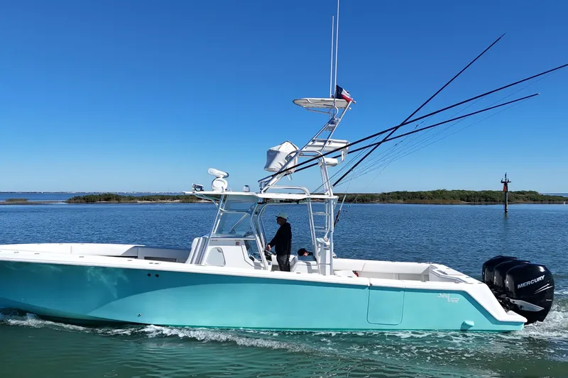 Slide: The Image of 2013 SeaVee 39B Center Console boat cruising on calm waters. - 20