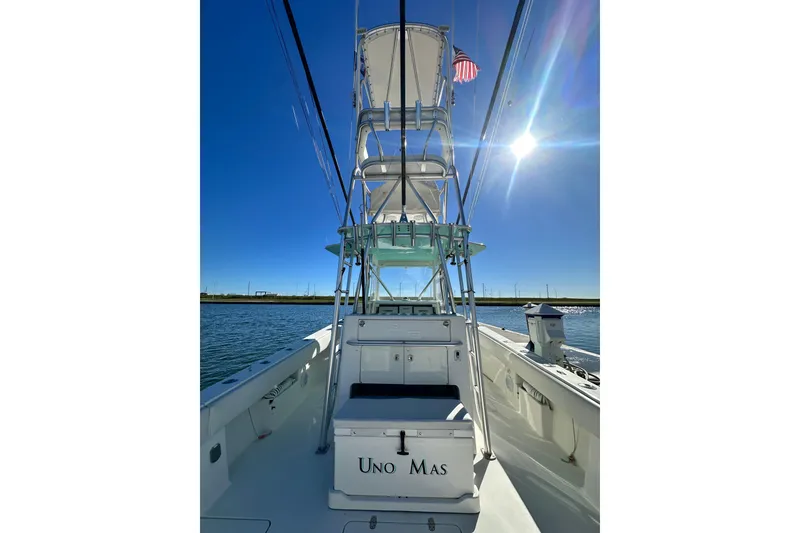 Slide: The Image of 2013 SeaVee 39B Center Console boat on water under clear blue sky. - 24
