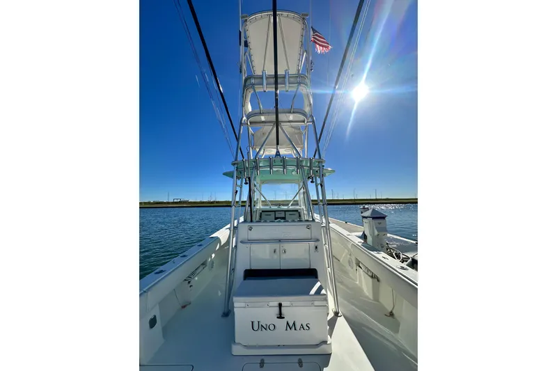 Slide: The Image of 2013 SeaVee 39B Center Console boat on water under clear blue sky. - 26