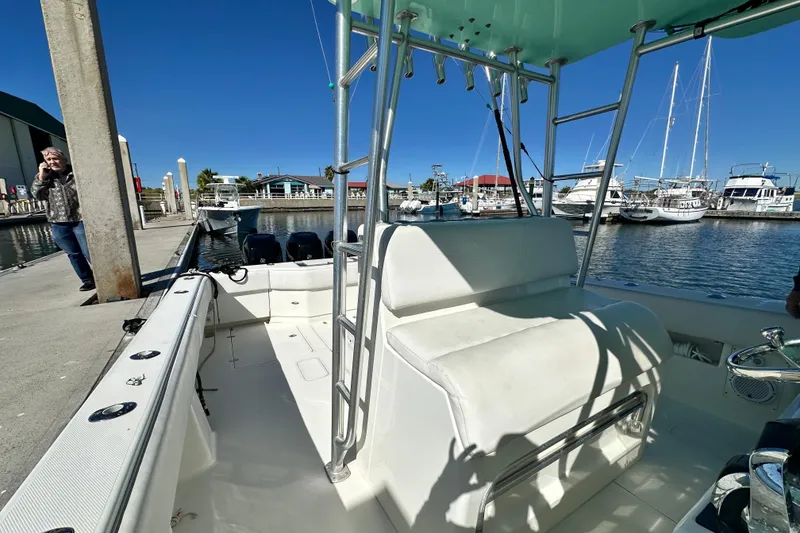 Slide: The Image of 2013 SeaVee 39B Center Console boat docked at marina under clear blue sky. - 28