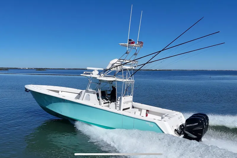 Slide: The Image of 2013 SeaVee 39B Center Console boat cruising on calm waters. - 3
