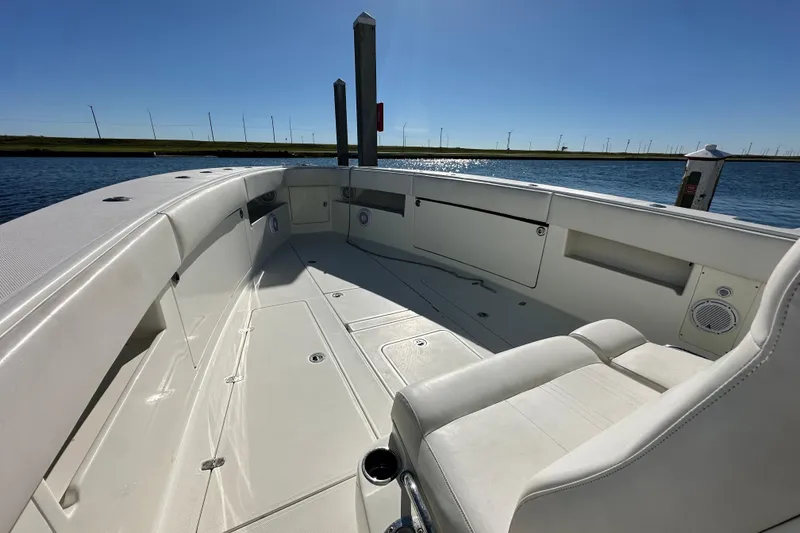 Slide: The Image of 2013 SeaVee 39B Center Console boat interior, featuring spacious seating and storage compartments. - 32
