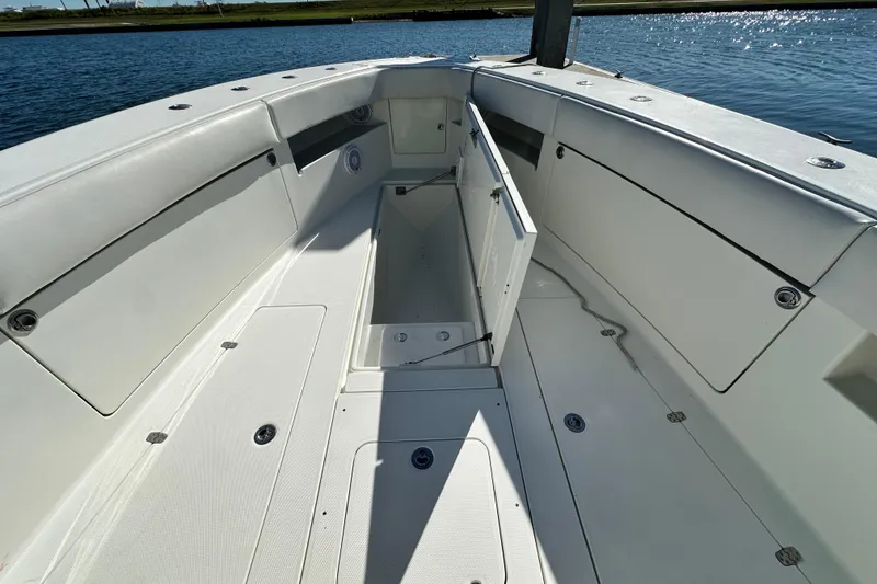 Slide: The Image of 2013 SeaVee 39B Center Console boat interior with open storage compartment. - 35