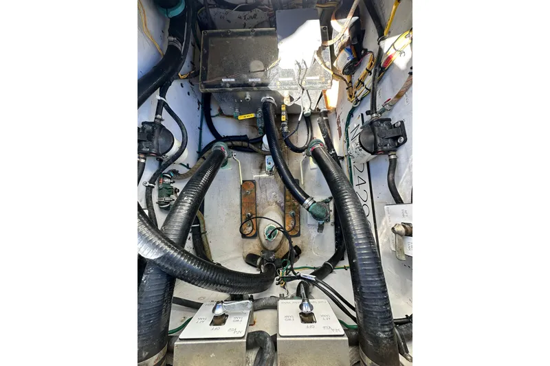 Slide: The Image of Engine compartment of a 2013 SeaVee 39B Center Console boat, showing hoses and wiring. - 40