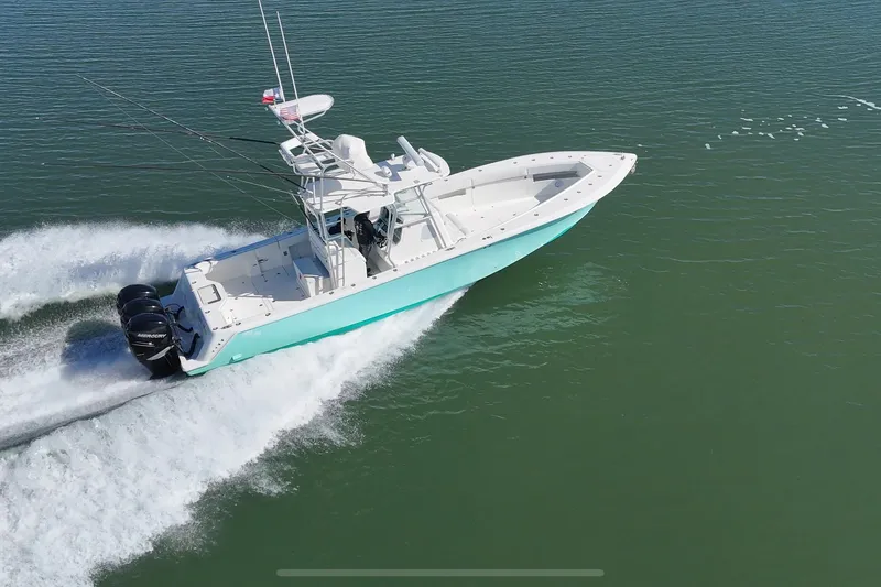 Slide: The Image of 2013 SeaVee 39B Center Console boat cruising on open water. - 5