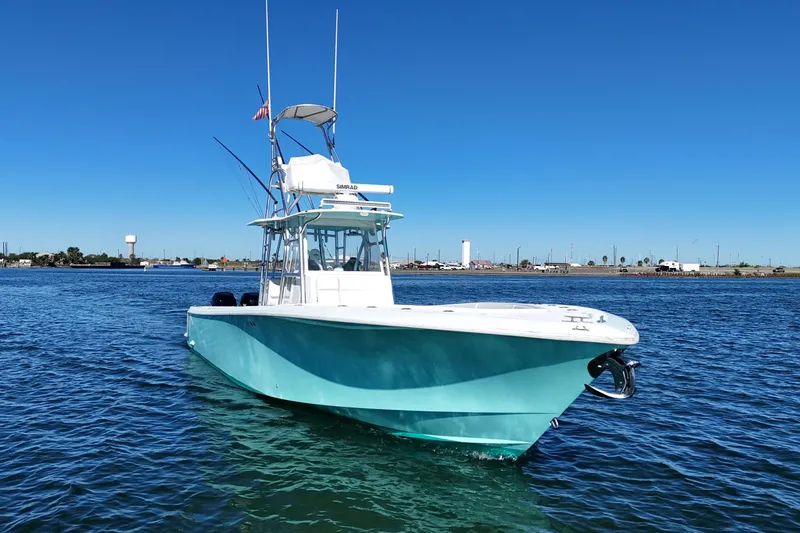 Slide: The Image of 2013 SeaVee 39B Center Console boat on calm water, clear blue sky. - 9