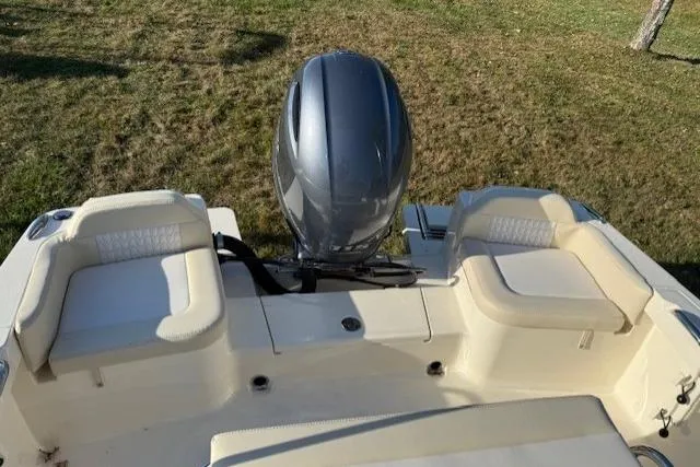 Slide: The Image of 2026 Scout 188 Sportfish boat with dual seating and outboard motor. - 5