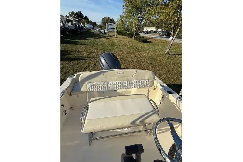 Slide: The Image of 2026 Scout 188 Sportfish boat interior with seating and steering wheel. - 6