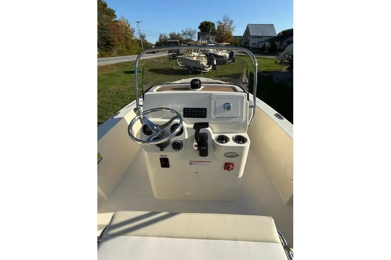 Slide: The Image of 2026 Scout 188 Sportfish boat console with steering wheel and controls. - 7
