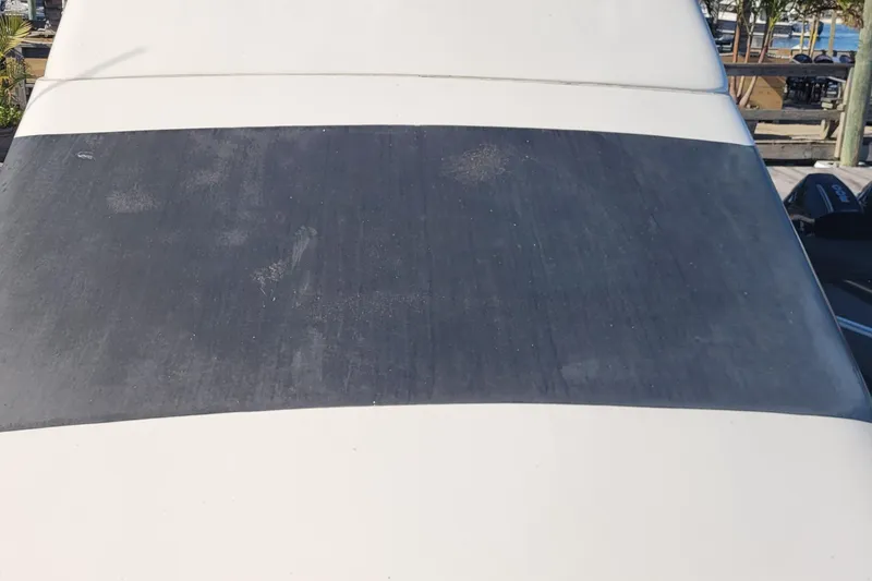 Slide: The Image of 2001 Luhrs 34 Convertible boat windshield, close-up view. - 17